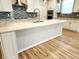 Spacious kitchen with island, mosaic backsplash and stainless steel appliances at 4734 Cleome Dr, Plainfield, IN 46168