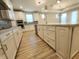 Open kitchen with island and view to living room at 4734 Cleome Dr, Plainfield, IN 46168