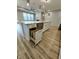 Open island design featuring granite countertops, stainless steel appliances and hidden trash cans at 4734 Cleome Dr, Plainfield, IN 46168