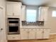 Kitchen featuring stainless steel oven and microwave combo with granite countertops at 4734 Cleome Dr, Plainfield, IN 46168