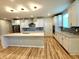Bright kitchen features modern stainless steel appliances, white cabinetry, and granite countertops at 4734 Cleome Dr, Plainfield, IN 46168