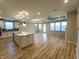 Open-concept living area with wood floors, recessed lighting, and abundant natural light at 4734 Cleome Dr, Plainfield, IN 46168