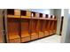 Well-lit locker room with individual wooden lockers and ample storage space at 4734 Cleome Dr, Plainfield, IN 46168