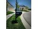 Close-up of a mailbox with house number, set in a manicured lawn and sidewalk at 4734 Cleome Dr, Plainfield, IN 46168