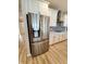 Kitchen featuring stainless steel LG refrigerator and modern white cabinetry at 4734 Cleome Dr, Plainfield, IN 46168