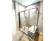 Modern glass enclosed shower features marble-look tile surround and a built-in bench at 4734 Cleome Dr, Plainfield, IN 46168