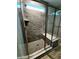Modern glass enclosed shower features marble-look tile surround, window, and a bench at 4734 Cleome Dr, Plainfield, IN 46168