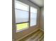 Bedroom with modern window shades and view of the green outdoors at 4734 Cleome Dr, Plainfield, IN 46168