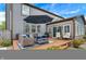 Backyard patio with comfortable seating, a shade umbrella and manicured landscaping offers a relaxing outdoor space at 48 E Wisteria Way, Westfield, IN 46074