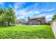 Large backyard features an in-ground pool, patio area, grassy lawn, and mature trees at 48 E Wisteria Way, Westfield, IN 46074