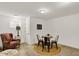 Finished basement featuring a cozy chair and round table, ideal for relaxation and entertaining at 48 E Wisteria Way, Westfield, IN 46074