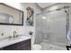 Beautiful bathroom featuring glass-enclosed tiled shower, vanity and wood-look oars as decor at 48 E Wisteria Way, Westfield, IN 46074