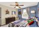 Inviting bedroom featuring playful decor, a cozy chair, and ample storage with a charming dresser at 48 E Wisteria Way, Westfield, IN 46074