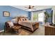 Inviting bedroom featuring warm tones, wooden furniture, a comfortable bed, and ample natural light at 48 E Wisteria Way, Westfield, IN 46074
