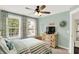 Bright bedroom with a serene atmosphere, floral curtains, and a cozy, inviting space at 48 E Wisteria Way, Westfield, IN 46074