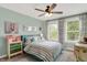 Charming bedroom featuring a bed with striped linens, decorative pillows, and whimsical accents at 48 E Wisteria Way, Westfield, IN 46074