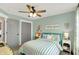 Cozy bedroom with stylish accents, soft lighting, and a comfortable bed with striped linens at 48 E Wisteria Way, Westfield, IN 46074