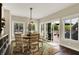 Bright dining area with large windows, slider door to deck, and casual seating at 48 E Wisteria Way, Westfield, IN 46074