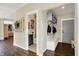 Inviting entryway features a built-in bench and hall tree for storage, with a view into the powder room at 48 E Wisteria Way, Westfield, IN 46074