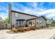 A well-maintained exterior featuring a backyard patio with a swimming pool, garden, and gray siding at 48 E Wisteria Way, Westfield, IN 46074