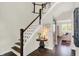 Inviting foyer showcases hardwood floors, staircase, and decorative accents at 48 E Wisteria Way, Westfield, IN 46074
