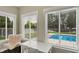 Bright office space with large windows overlooking the pool, perfect for work or relaxation at 48 E Wisteria Way, Westfield, IN 46074