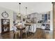 Well-lit kitchen and breakfast nook area featuring modern appliances, a large island, and stylish seating at 48 E Wisteria Way, Westfield, IN 46074