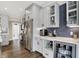 Contemporary kitchen features gray cabinets, stainless steel appliances, and a wine fridge at 48 E Wisteria Way, Westfield, IN 46074
