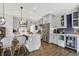 Modern kitchen with stainless steel appliances, gray cabinetry, and a functional island for cooking at 48 E Wisteria Way, Westfield, IN 46074
