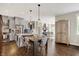 Eat-in kitchen area with pendant lighting and a stylish table, plus a view of the kitchen at 48 E Wisteria Way, Westfield, IN 46074