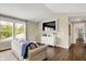 Bright living room with a cozy sofa, modern entertainment center, and an abundance of natural light at 48 E Wisteria Way, Westfield, IN 46074