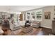 Open-concept living room flows into kitchen, showcasing stylish furnishings and abundant natural light at 48 E Wisteria Way, Westfield, IN 46074
