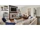Comfortable living room featuring a brick fireplace, shiplap walls, and neutral tones at 48 E Wisteria Way, Westfield, IN 46074