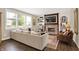 Cozy living room with a shiplap accent wall, brick fireplace, and large windows for natural light at 48 E Wisteria Way, Westfield, IN 46074