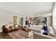 Spacious living room with hardwood floors that open to a modern kitchen, perfect for entertaining at 48 E Wisteria Way, Westfield, IN 46074