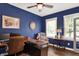Bright blue home office with stylish furnishings, including a desk, chair, and decorative accents at 48 E Wisteria Way, Westfield, IN 46074
