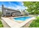In-ground swimming pool with surrounding patio, landscaping, and view of the home's exterior at 48 E Wisteria Way, Westfield, IN 46074