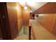 View of the finished attic with a slanted roof, wood paneling, and storage at 489 Highland St, Morgantown, IN 46160