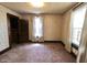 Bedroom with floral wallpaper, natural light, and an open door way at 489 Highland St, Morgantown, IN 46160
