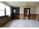 Dining room with built-in cabinetry and view into adjacent kitchen at 489 Highland St, Morgantown, IN 46160