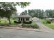Exterior showcasing the home's architecture, detached garage and inviting curb appeal at 489 Highland St, Morgantown, IN 46160