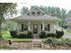 Charming home with a welcoming porch swing and nicely landscaped front yard at 489 Highland St, Morgantown, IN 46160
