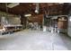 Spacious garage with workbench and overhead storage at 489 Highland St, Morgantown, IN 46160