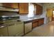 Kitchen featuring wood cabinets and standard white appliances at 489 Highland St, Morgantown, IN 46160