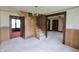 View of the living room featuring the stairway and doorway to another room at 489 Highland St, Morgantown, IN 46160