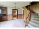 Living room with stairs, cabinets and an open view to the kitchen at 489 Highland St, Morgantown, IN 46160