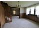 View of living room with view to adjacent room and featuring staircase at 489 Highland St, Morgantown, IN 46160