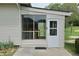 Enclosed sunroom with large window and door, offering a bright and relaxing space at 489 Highland St, Morgantown, IN 46160