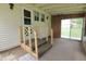 Enclosed sunroom with carpeted flooring and access to the outdoors at 489 Highland St, Morgantown, IN 46160