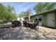 Outdoor patio area featuring a dining set, grill and a well-maintained backyard space for entertaining at 5041 Norcroft Dr, Indianapolis, IN 46221